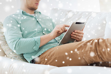 Image showing close up of man with tablet pc computer at home