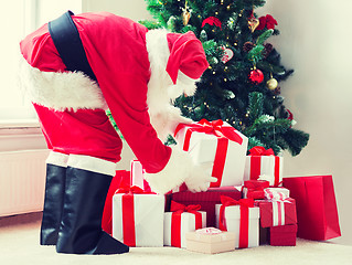 Image showing man in costume of santa claus with presents