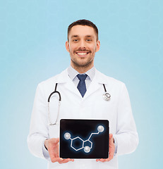 Image showing smiling male doctor showing tablet pc screen