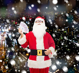 Image showing man in costume of santa claus with euro money