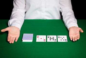 Image showing holdem dealer with playing cards