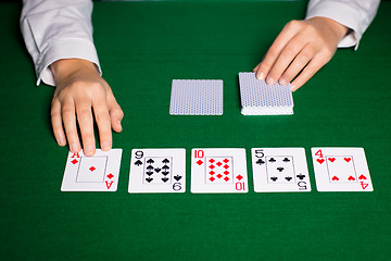 Image showing holdem dealer with playing cards