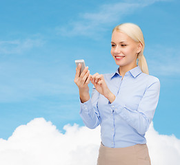 Image showing young smiling businesswoman with smartphone