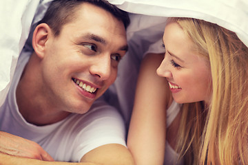 Image showing happy couple sleeping in bed