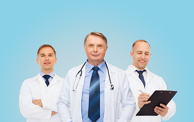 Image showing group of smiling male doctors in white coats