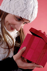 Image showing Girl looking into gift