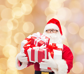 Image showing man in costume of santa claus with gift boxes