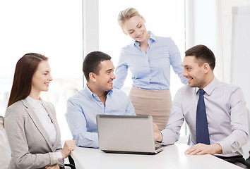 Image showing business team working with laptop in office