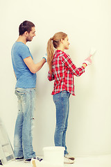 Image showing smiling couple doing renovations at home