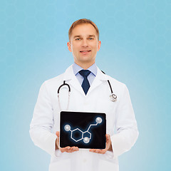 Image showing smiling male doctor showing tablet pc screen