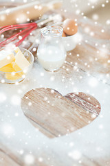 Image showing  heart of flour on wooden table at home