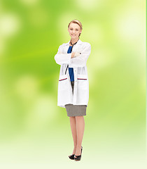 Image showing smiling young female doctor in white coat