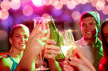 Image showing smiling friends with wine glasses and beer in club