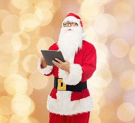 Image showing man in costume of santa claus with tablet pc