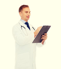 Image showing smiling male doctor with clipboard and stethoscope