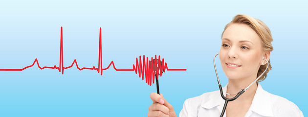 Image showing smiling female doctor listening to heartbeat