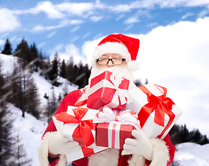 Image showing man in costume of santa claus with gift boxes