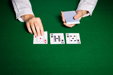 Image showing holdem dealer with playing cards