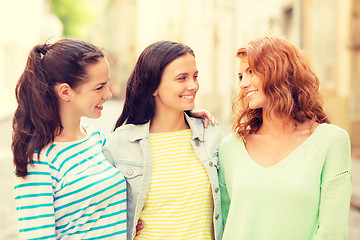 Image showing smiling teenage girls with on street