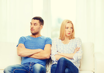 Image showing unhappy couple having argument at home