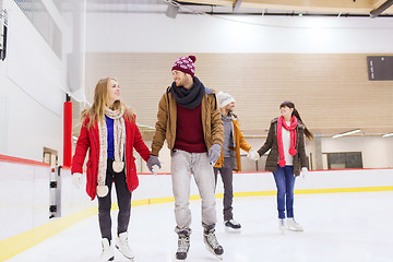 Image showing happy friends on skating rink