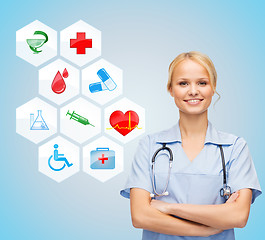 Image showing smiling doctor over medical icons blue background