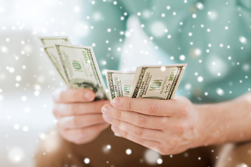 Image showing close up of man counting money at home