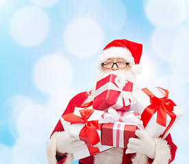 Image showing man in costume of santa claus with gift boxes