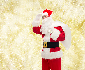 Image showing man in costume of santa claus with bag