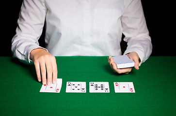 Image showing holdem dealer with playing cards