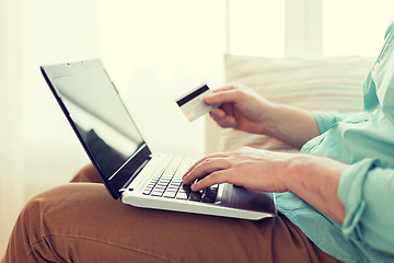 Image showing close up of man with laptop and credit card