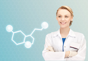 Image showing smiling female doctor with molecule of serotonin