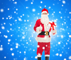 Image showing man in costume of santa claus with gift box