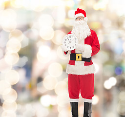 Image showing man in costume of santa claus with clock