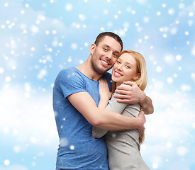 Image showing happy couple hugging outdoors