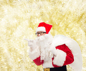 Image showing man in costume of santa claus with bag