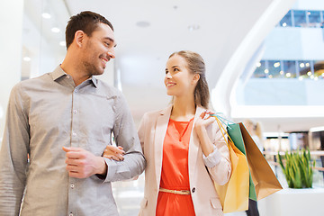 Image showing happy young couple with shopping bags in mall