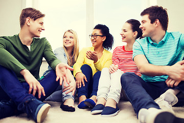 Image showing five smiling teenagers having fun at home