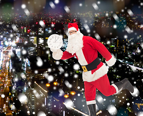 Image showing man in costume of santa claus with clock