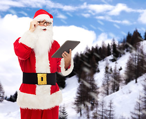 Image showing man in costume of santa claus with tablet pc