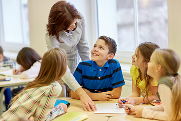 Image showing group of school kids writing test in classroom