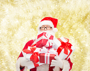 Image showing man in costume of santa claus with gift boxes