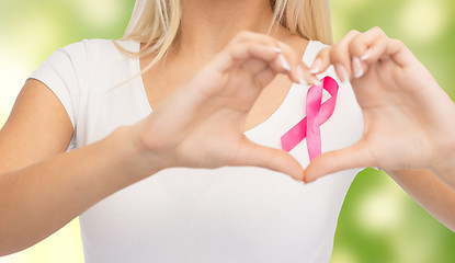 Image showing close up of woman and pink cancer awareness ribbon