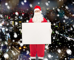 Image showing man in costume of santa claus with billboard