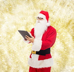 Image showing man in costume of santa claus with tablet pc