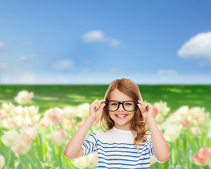 Image showing smiling cute little girl with black eyeglasses