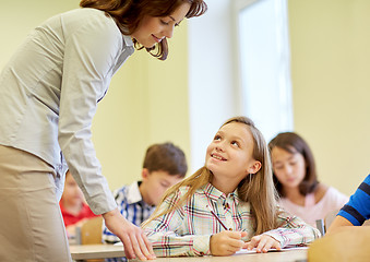 Image showing group of school kids writing test in classroom