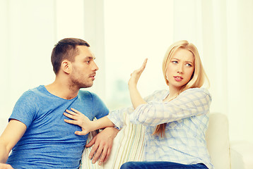 Image showing unhappy couple having argument at home