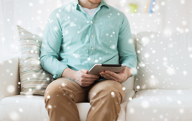 Image showing close up of man with tablet pc computer at home