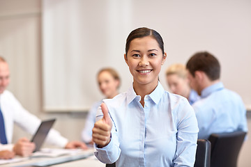 Image showing group of smiling businesspeople meeting in office